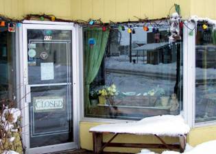 [Photo of a snowy store front.]